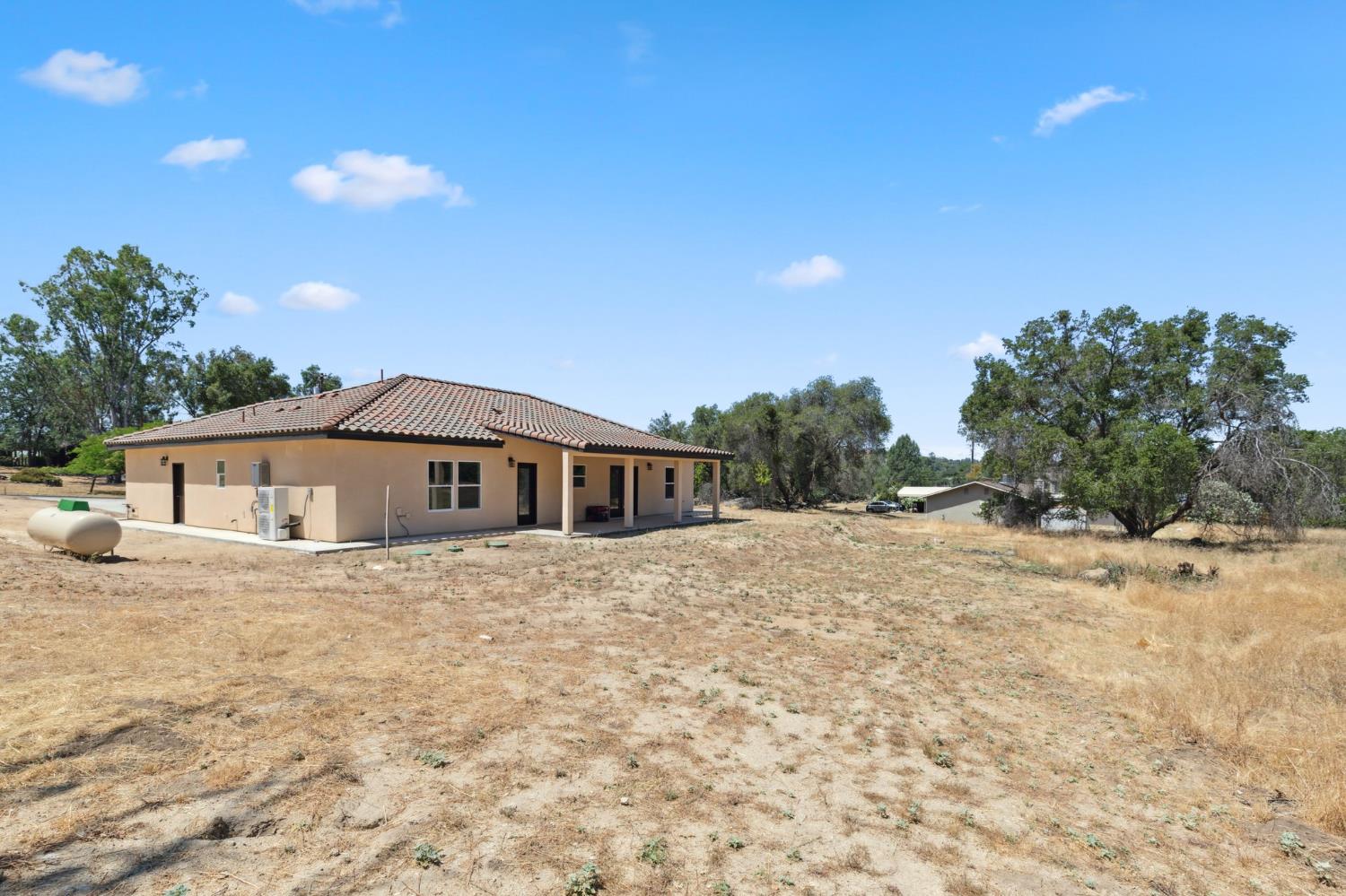 31007 Revis Road Coarsegold, CA 93614 - Photo 29 of 41 a front view of a house with a yard