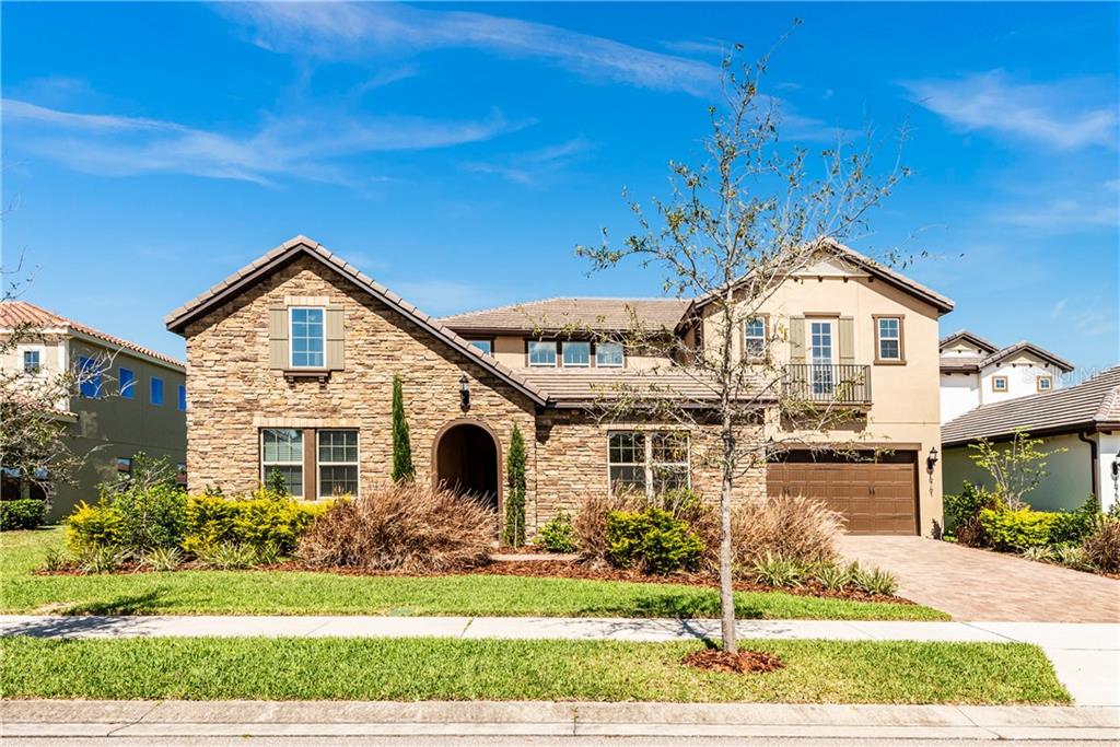 Stunning LIKE NEW home with ENDLESS UPGRADES is ready and waiting for you in the GATED COMMUNITY of WATERSIDE ON JOHNS LAKE!