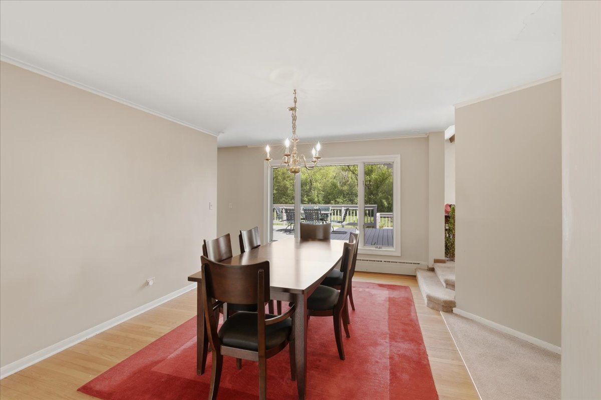 520 Merri Oaks Road Barrington Hills, IL 60010 - Photo 11 of 43 a view of a dining room with furniture window and outside view
