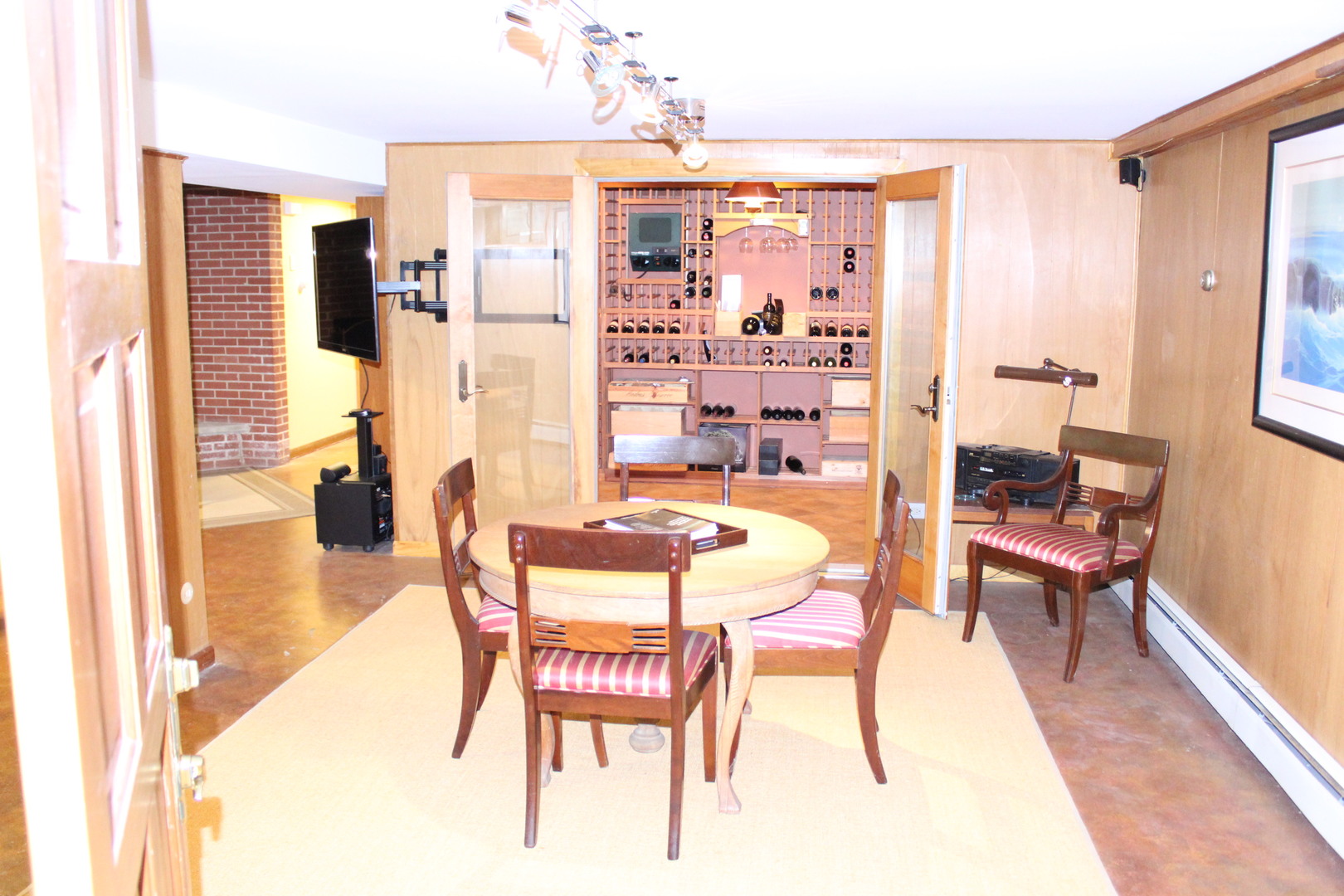 520 Merri Oaks Road Barrington Hills, IL 60010 - Photo 16 of 31 a dining room with furniture and a chandelier