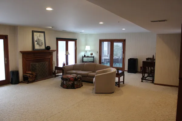 a living room with furniture and a fireplace
