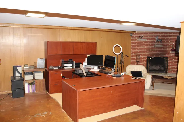 a dining room with furniture and a chandelier