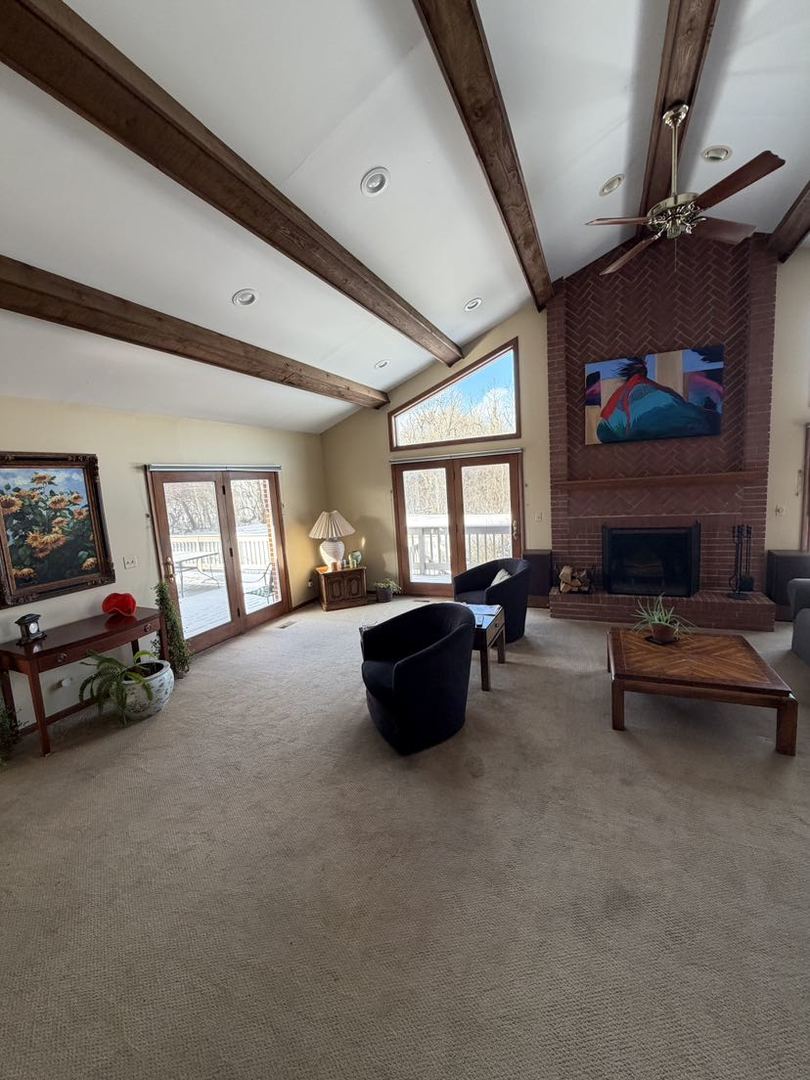 520 Merri Oaks Road Barrington Hills, IL 60010 - Photo 23 of 31 a living room with furniture and a flat screen tv