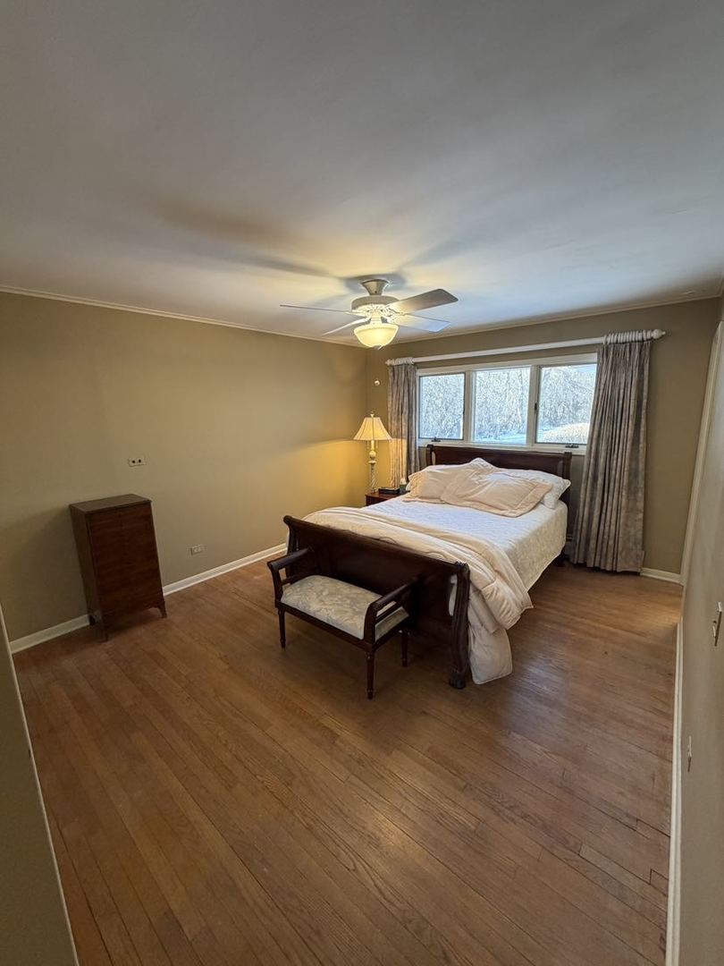 520 Merri Oaks Road Barrington Hills, IL 60010 - Photo 27 of 31 a bedroom with a bed and window