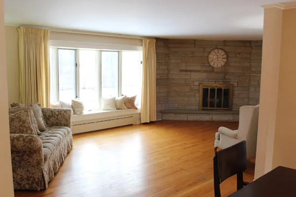 a living room with furniture and a fireplace