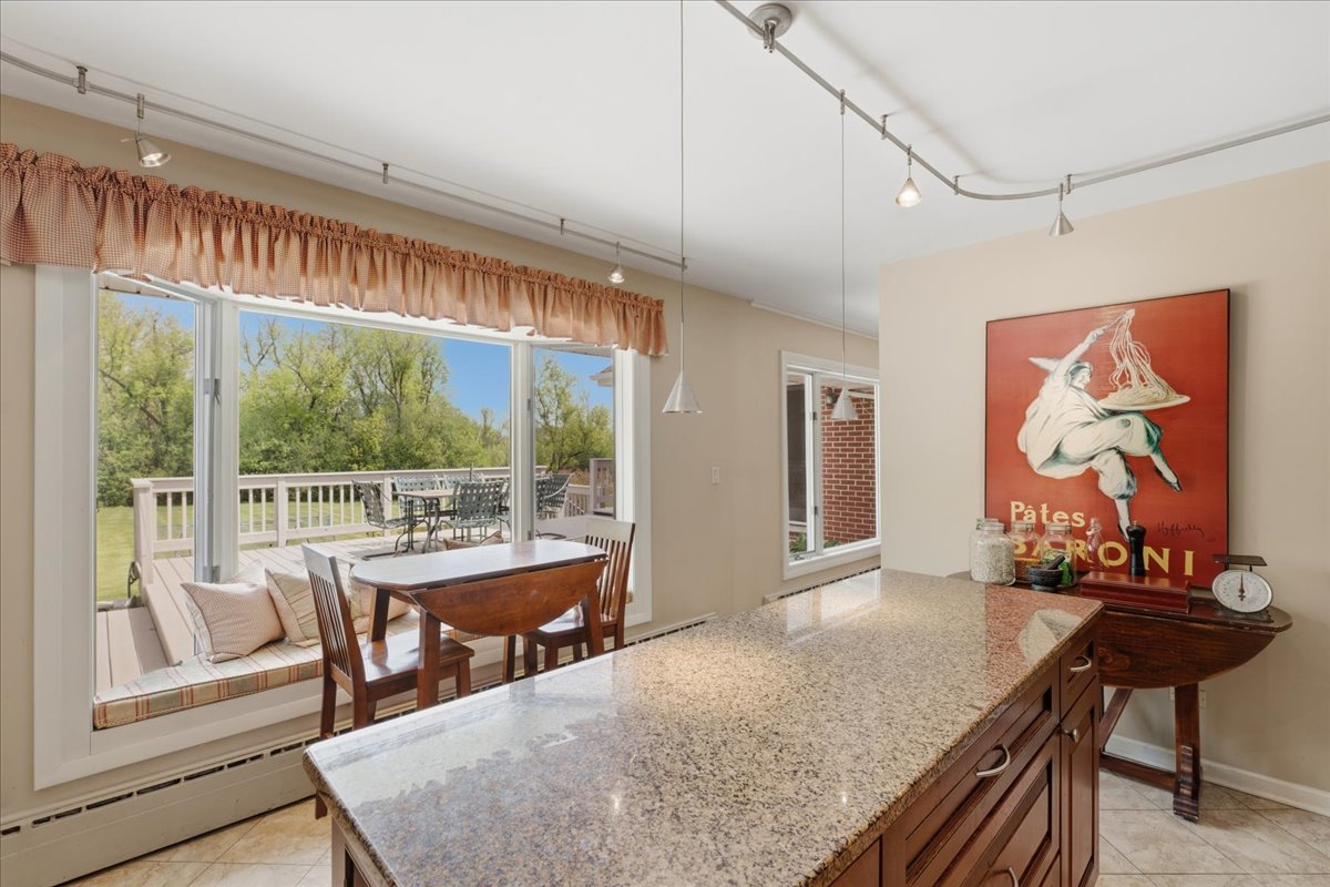 520 Merri Oaks Road Barrington Hills, IL 60010 - Photo 6 of 43 a view of a dining room with furniture large window and outside view
