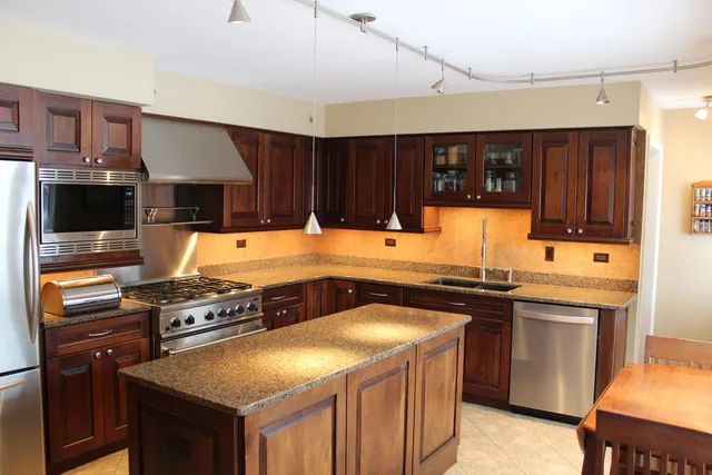 a kitchen with a stove and a sink