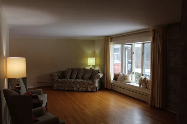 a living room with furniture and a window