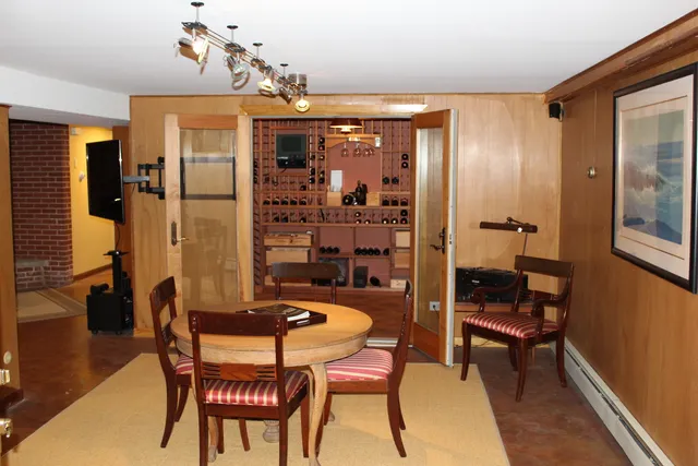 a dining room with furniture and window