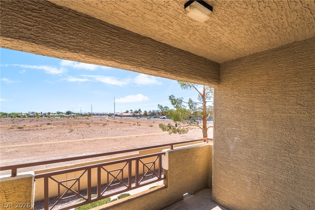 8070 West Russell Road, Unit 2024 Las Vegas, NV 89113 - Photo 16 of 19 Enjoy arid landscape views from this elevated patio, ideal for outdoor relaxation.