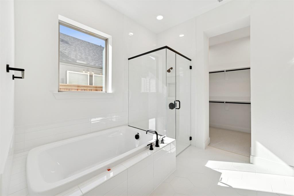 1842 Cole Road Van Alstyne, TX 75495 - Photo 17 of 35 a bathroom with a bathtub and a shower