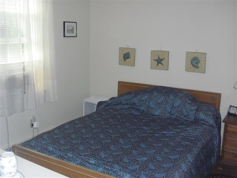 19 Uncle Henrys Road Mashpee, MA 02649 - Photo 10 of 15 a bedroom with a bed and a window