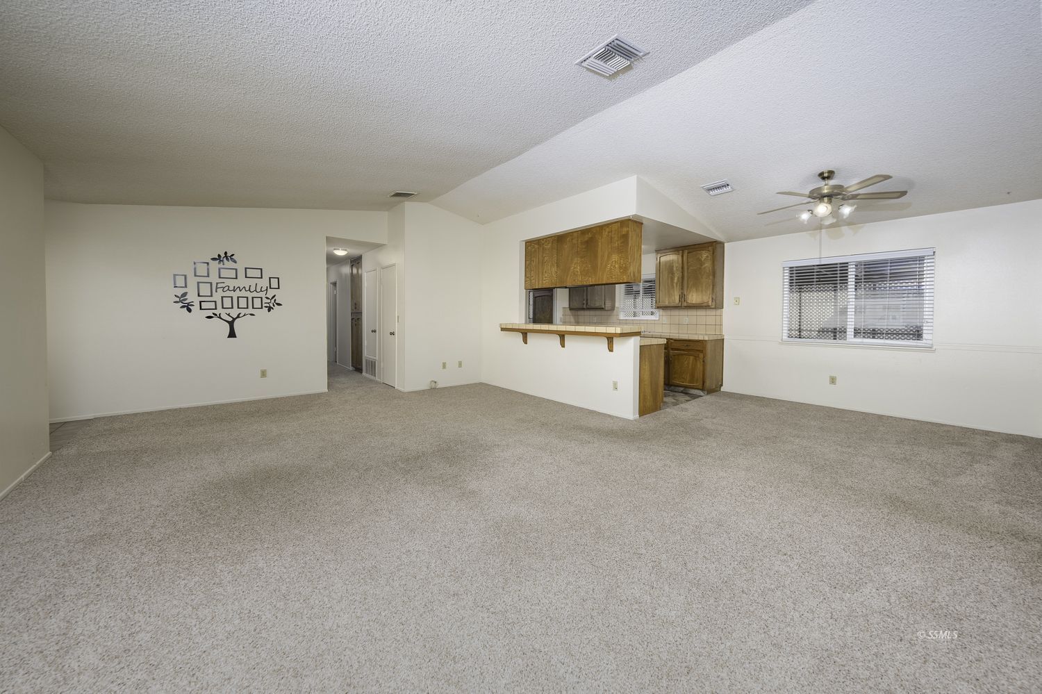 1240 West Boston Avenue Ridgecrest, CA 93555 - Photo 18 of 38 an empty room with windows and ceiling fan