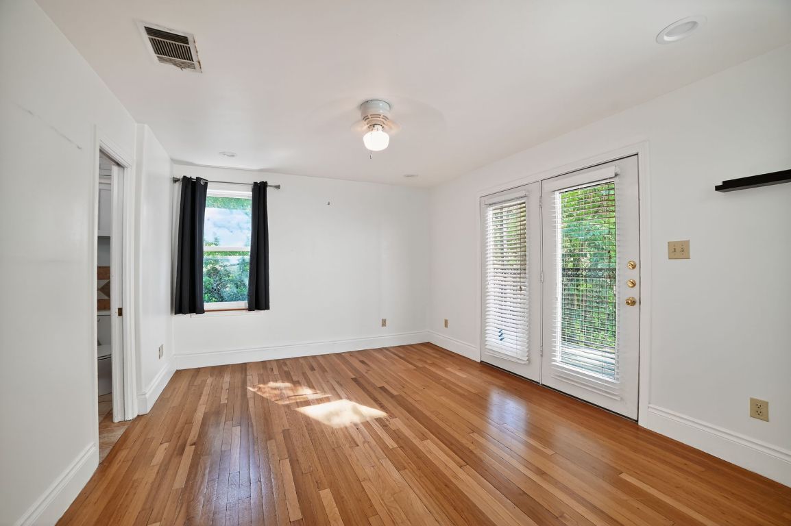 2003 Griswold Lane, Unit A Austin, TX 78703 - Photo 12 of 21 Spare room with light wood-style flooring and a ceiling fan