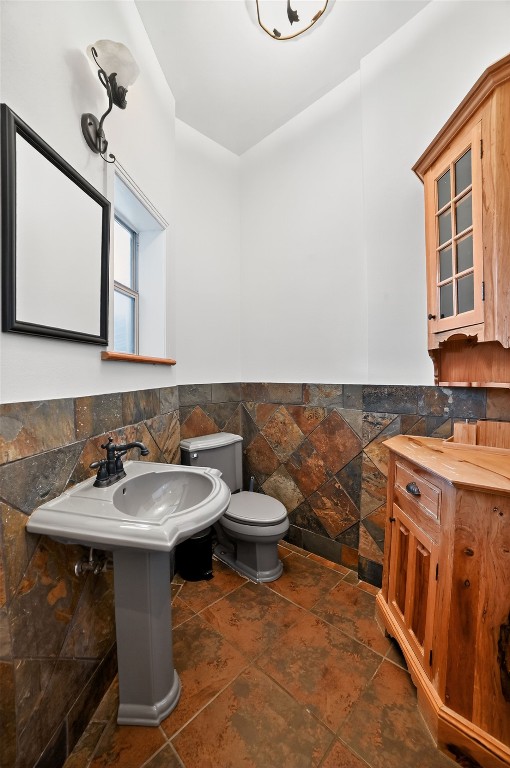 2003 Griswold Lane, Unit A Austin, TX 78703 - Photo 18 of 21 Bathroom featuring a wainscoted wall and tile walls