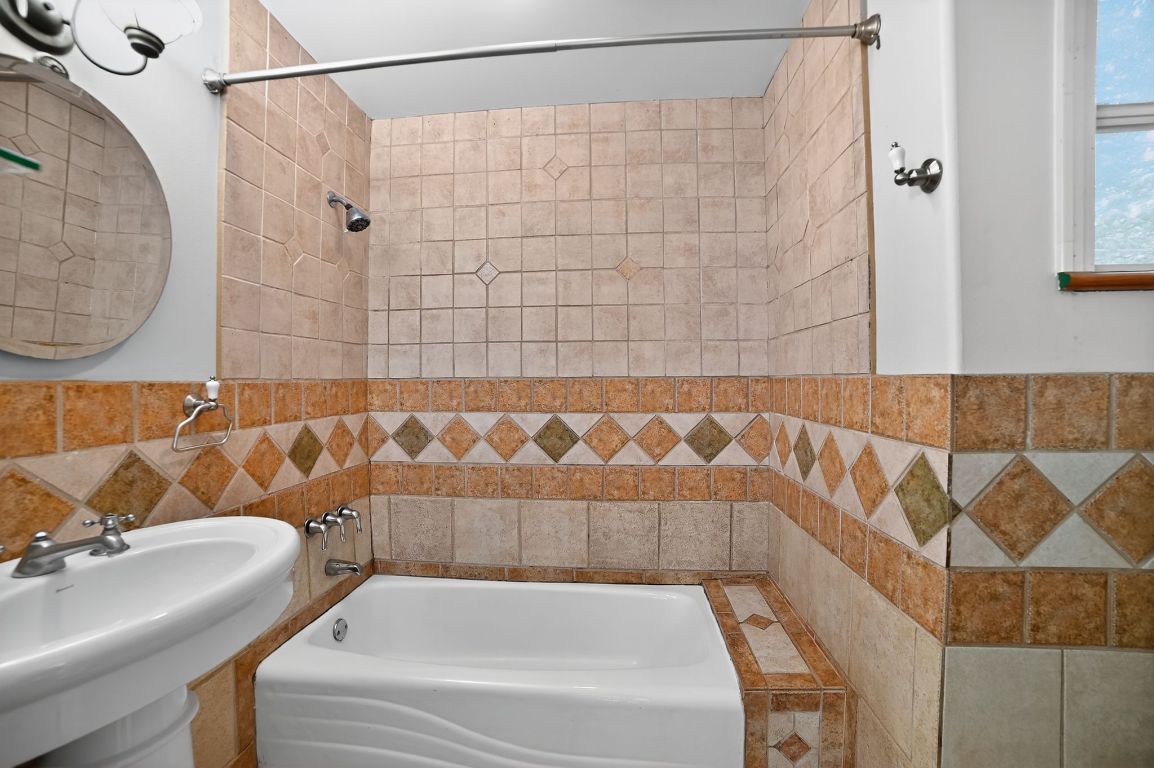 2003 Griswold Lane, Unit A Austin, TX 78703 - Photo 19 of 21 Bathroom featuring tile walls and tub / shower combination