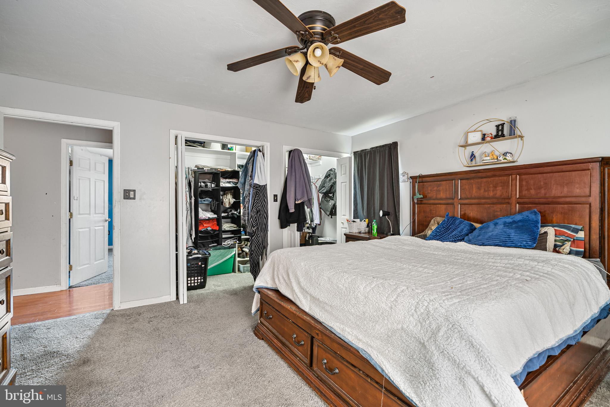 225 Pine Ridge Road Aspers, PA 17304 - Photo 11 of 42 a bedroom with a bed and a chandelier