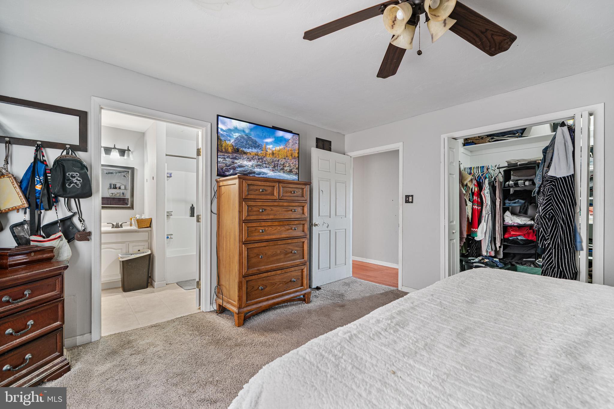 225 Pine Ridge Road Aspers, PA 17304 - Photo 12 of 42 a bed room with a bed and a walk in closet