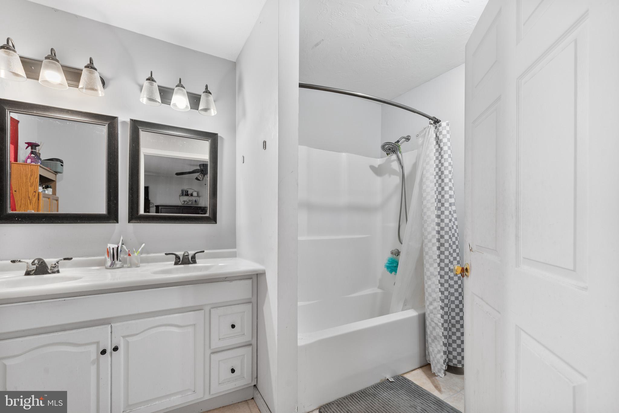 225 Pine Ridge Road Aspers, PA 17304 - Photo 14 of 42 a bathroom with a tub sink and mirror
