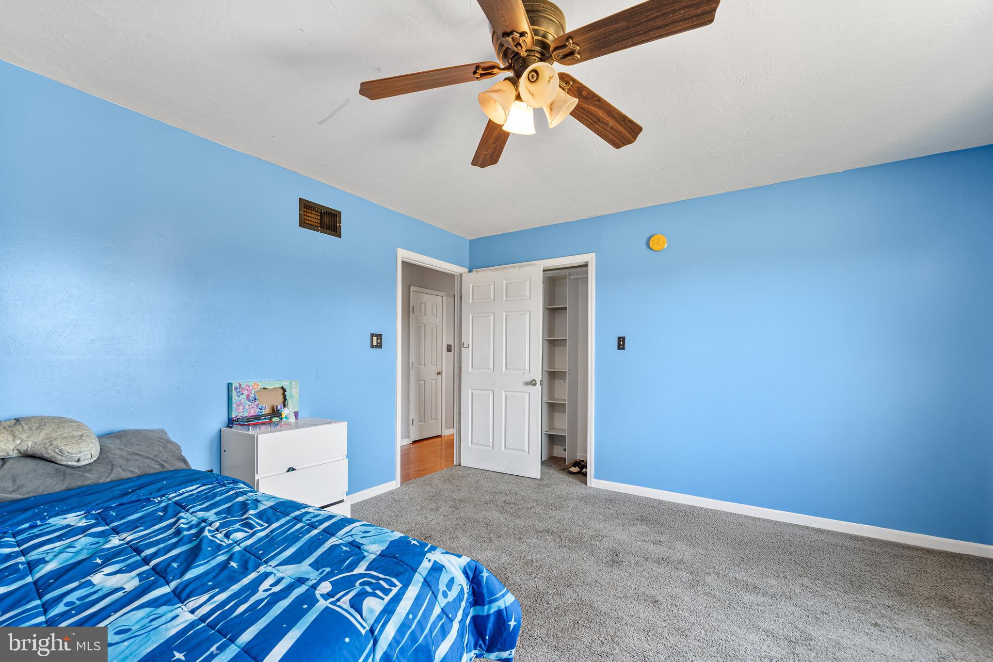 225 Pine Ridge Road Aspers, PA 17304 - Photo 18 of 42 a bedroom with a bed and a chandelier