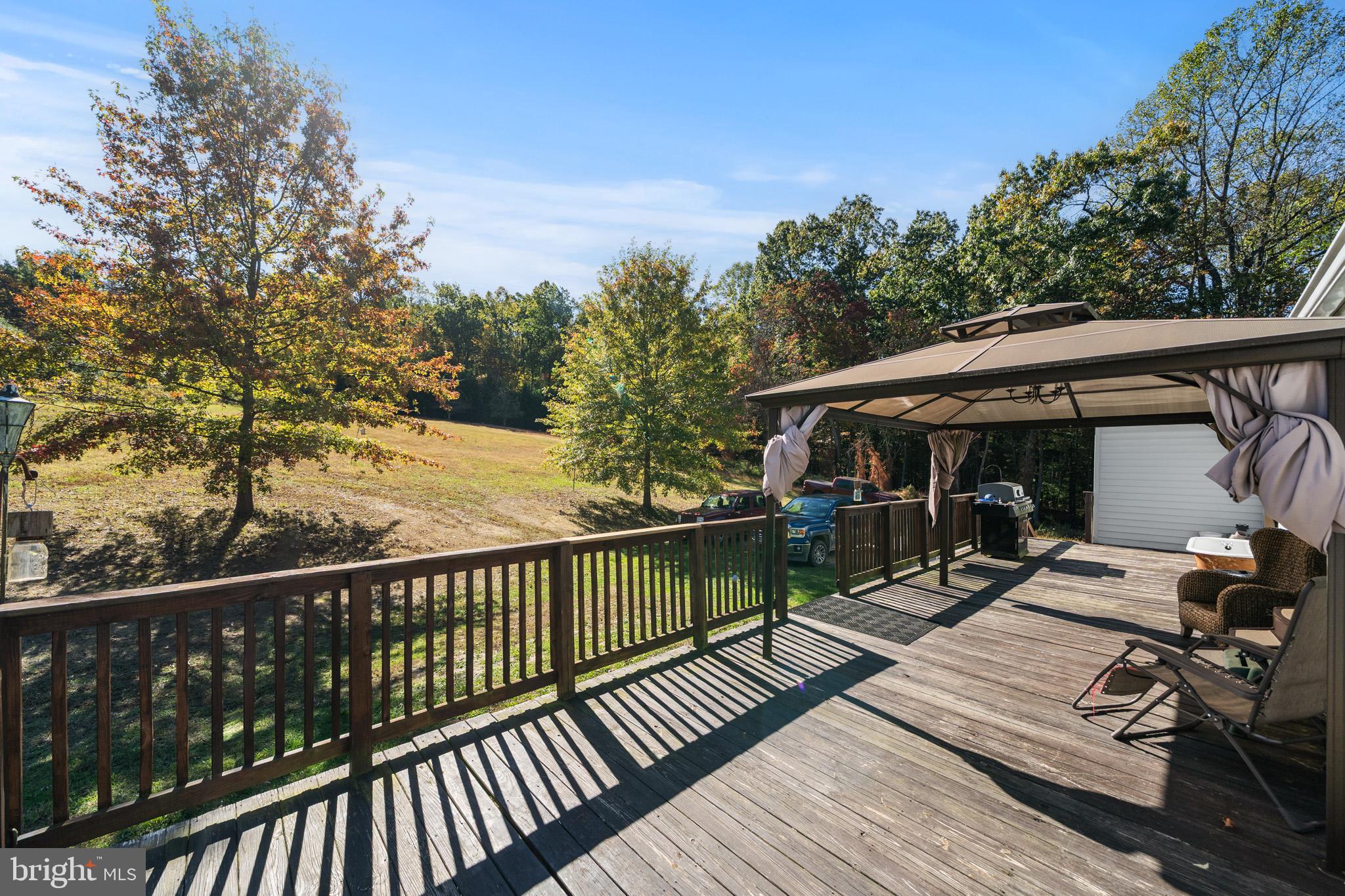225 Pine Ridge Road Aspers, PA 17304 - Photo 29 of 42 a view of a wooden deck with a patio