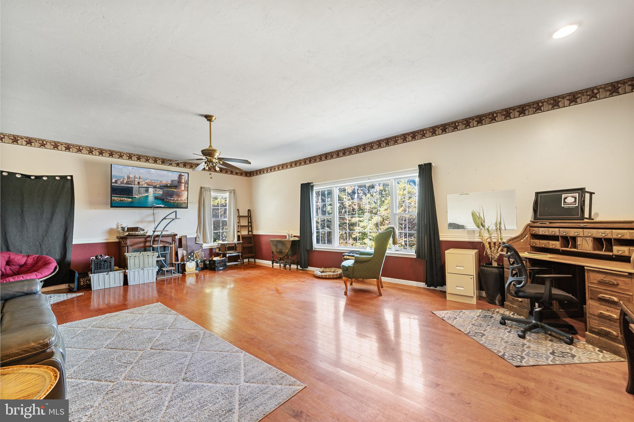 225 Pine Ridge Road Aspers, PA 17304 - Photo 4 of 42 a living room with furniture and a flat screen tv