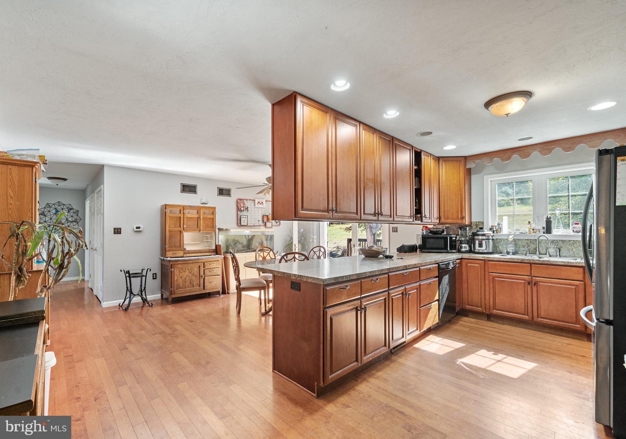 225 Pine Ridge Road Aspers, PA 17304 - Photo 6 of 42 a large kitchen with stainless steel appliances lots of counter top space