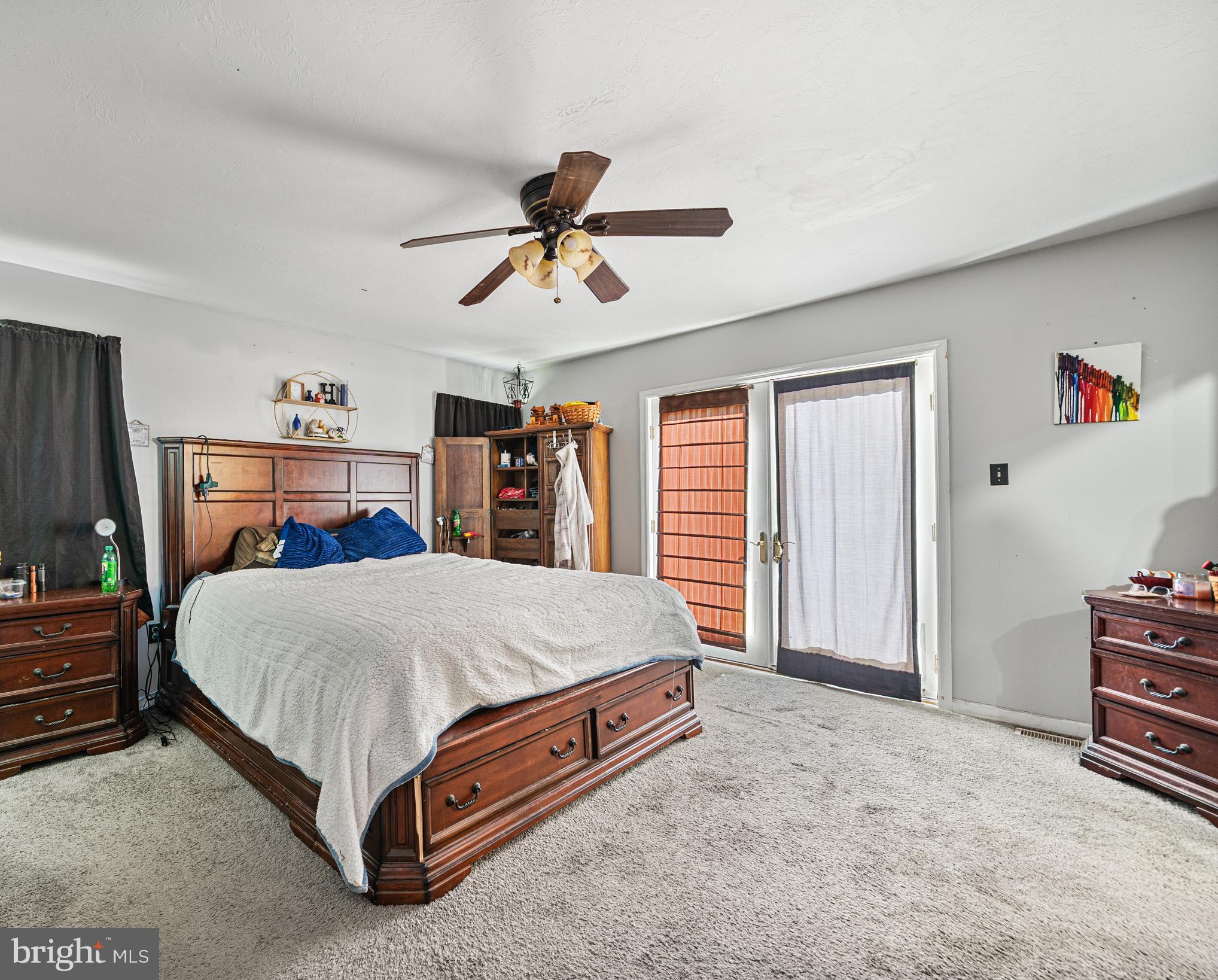 225 Pine Ridge Road Aspers, PA 17304 - Photo 10 of 42 a bed room with a bed and a chandelier