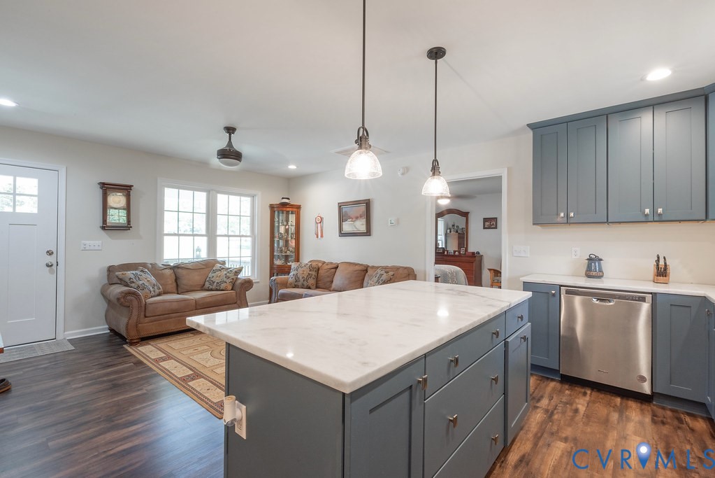 4336 Hells Bend Road Palmyra, VA 22963 - Photo 10 of 35 Kitchen island featuring a white countertop and bl