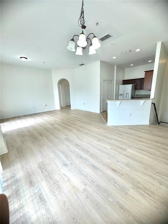 6404 South Goldenrod Road, Unit 2A Orlando, FL 32822 - Photo 40 of 40 a view of a kitchen with a sink and a large mirror
