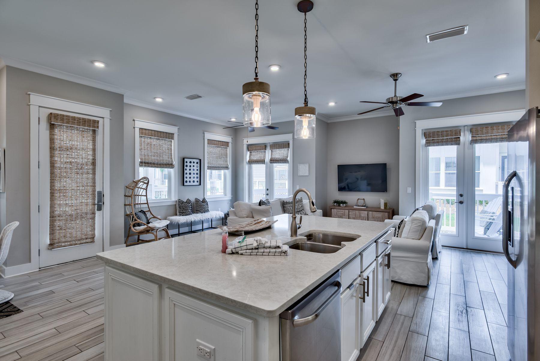 35 Milestone Dr Inlet Beach, Unit A Inlet Beach, FL 32461 - Photo 11 of 31 a view of a a dining table chairs and a chandelier
