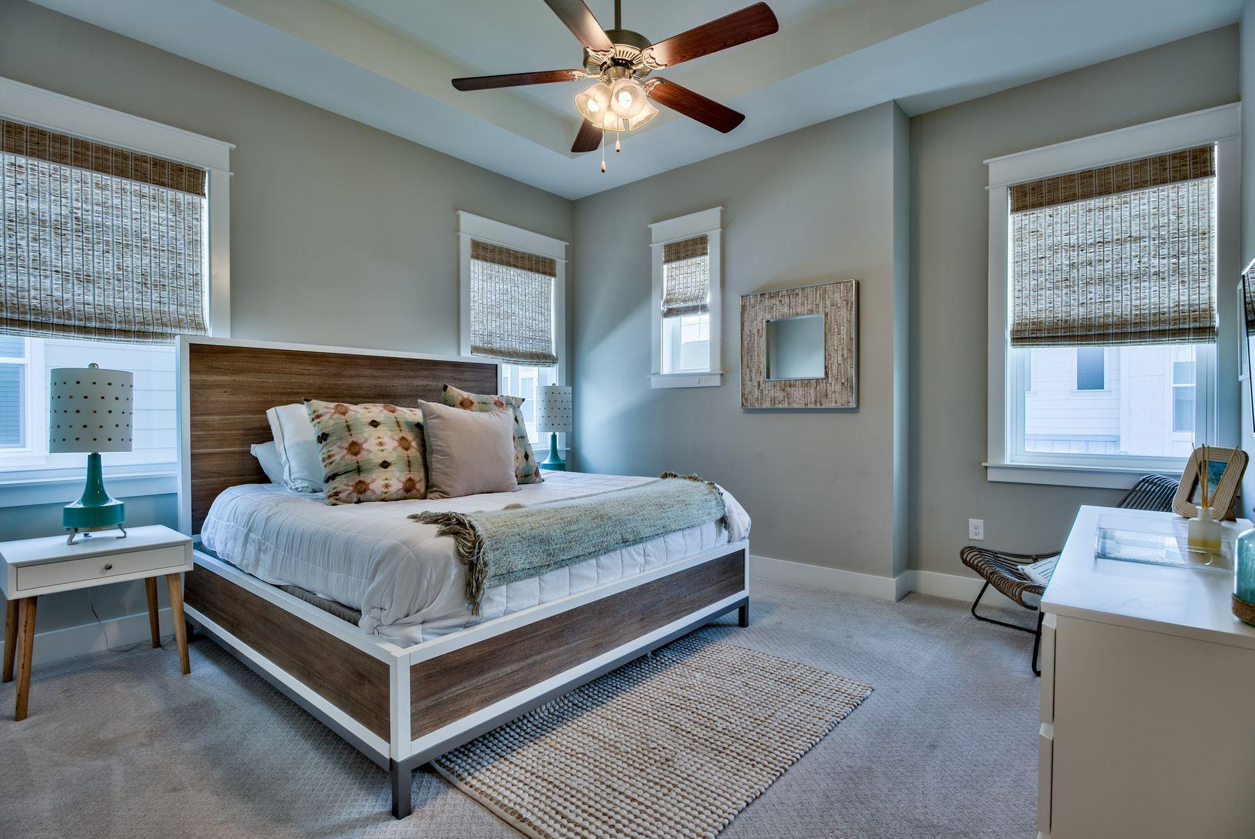 35 Milestone Dr Inlet Beach, Unit A Inlet Beach, FL 32461 - Photo 16 of 31 a bedroom with a bed and a desk