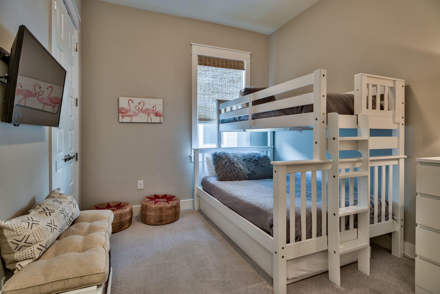 35 Milestone Dr Inlet Beach, Unit A Inlet Beach, FL 32461 - Photo 21 of 31 a bedroom with furniture and a large window