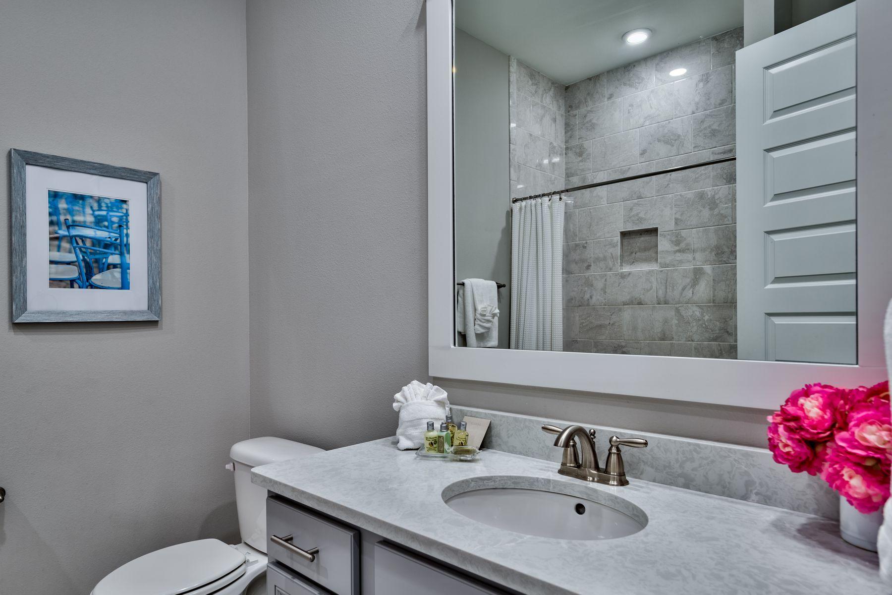 35 Milestone Dr Inlet Beach, Unit A Inlet Beach, FL 32461 - Photo 23 of 31 a bathroom with a sink toilet and shower