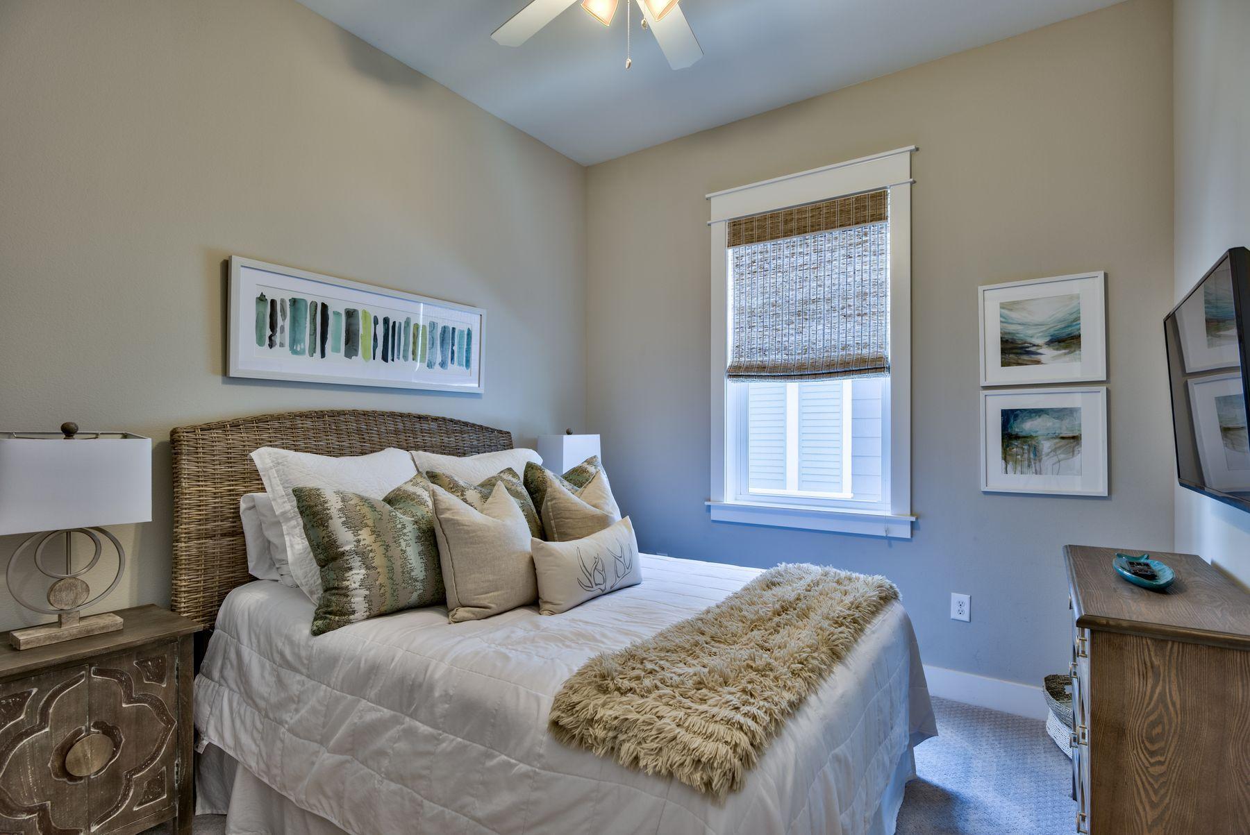 35 Milestone Dr Inlet Beach, Unit A Inlet Beach, FL 32461 - Photo 24 of 31 a bed sitting in a bedroom next to a window