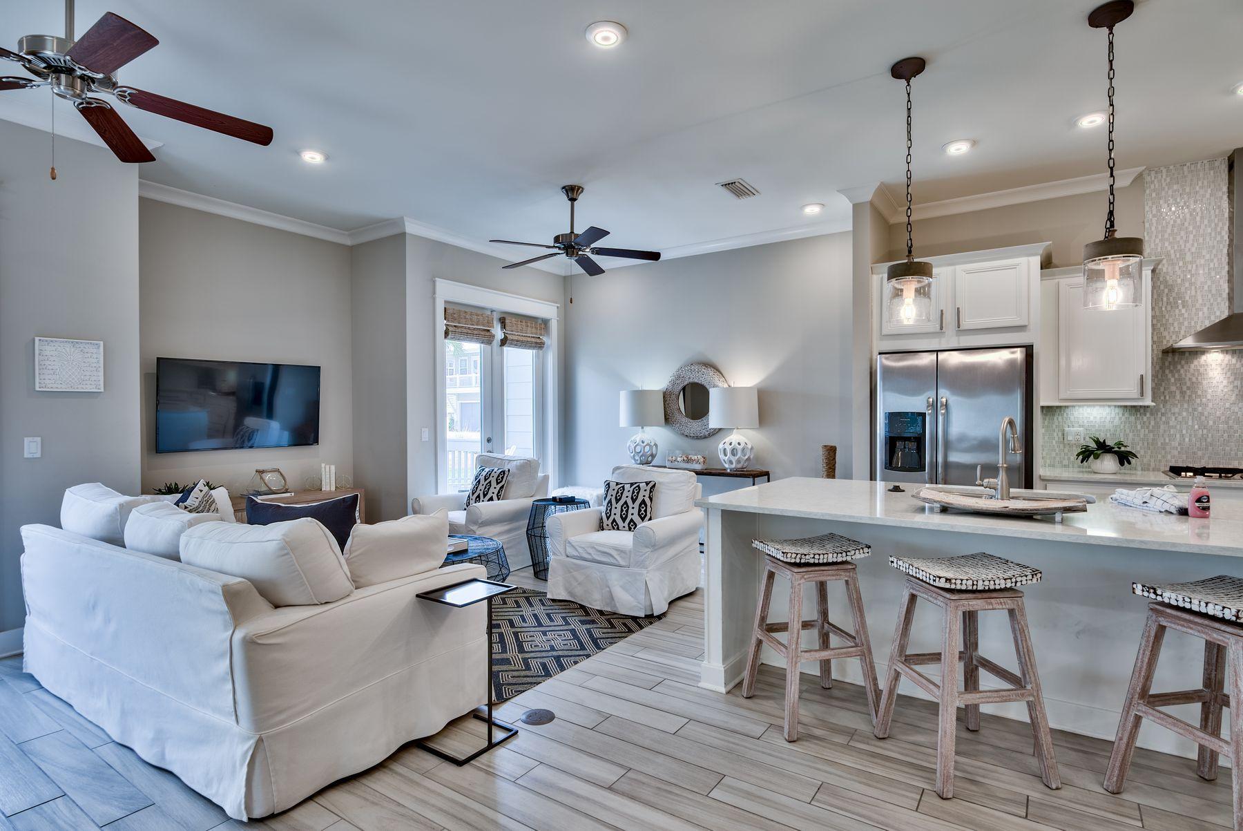 35 Milestone Dr Inlet Beach, Unit A Inlet Beach, FL 32461 - Photo 3 of 31 a living room with furniture kitchen view and a chandelier