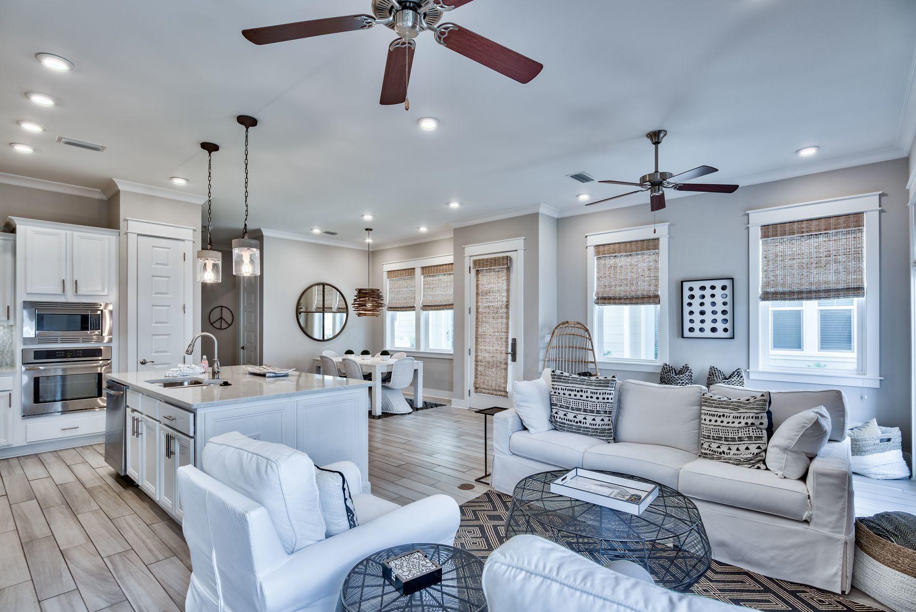 35 Milestone Dr Inlet Beach, Unit A Inlet Beach, FL 32461 - Photo 5 of 31 a living room with furniture kitchen view and a chandelier