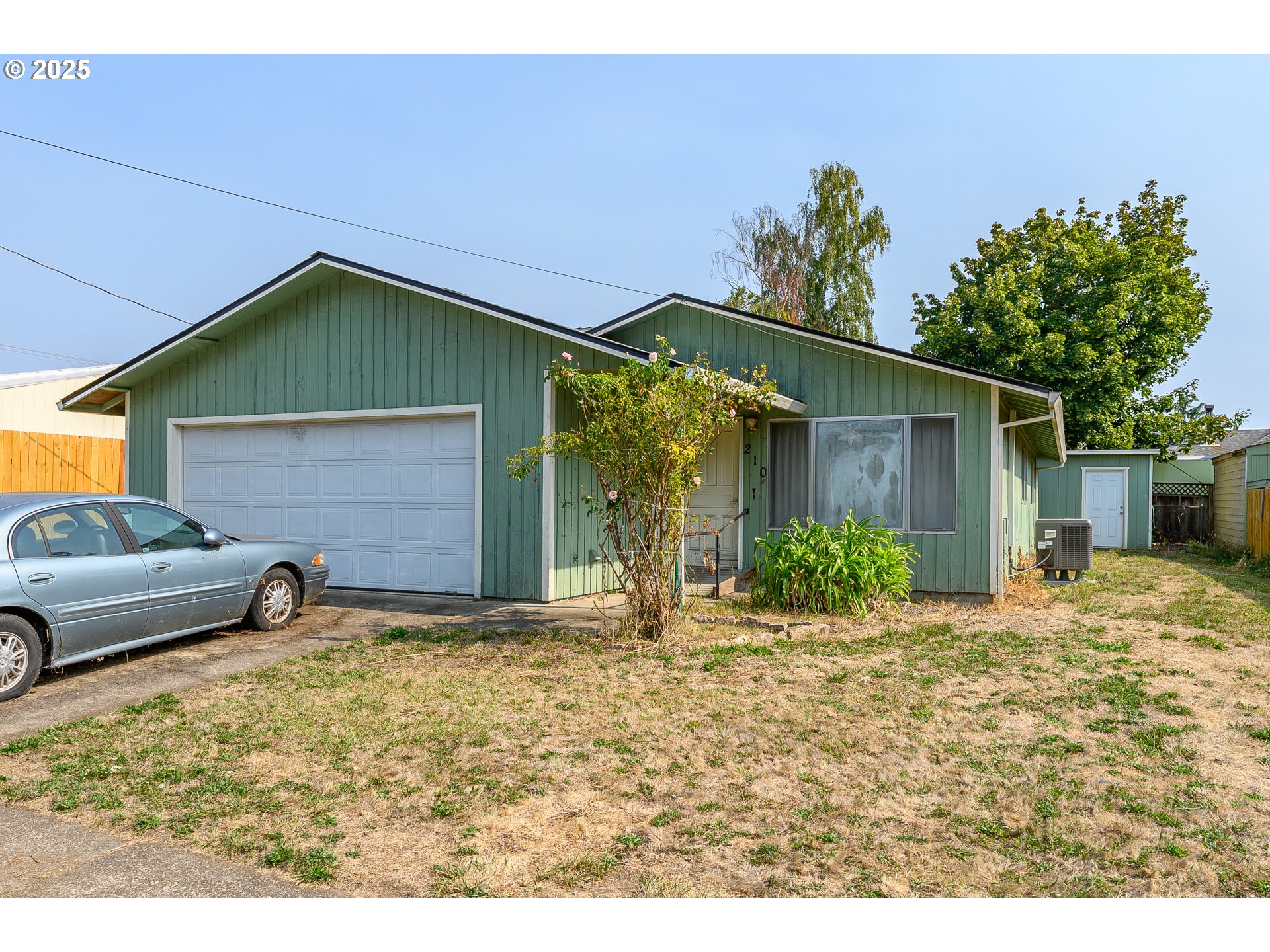 a house view with a backyard space