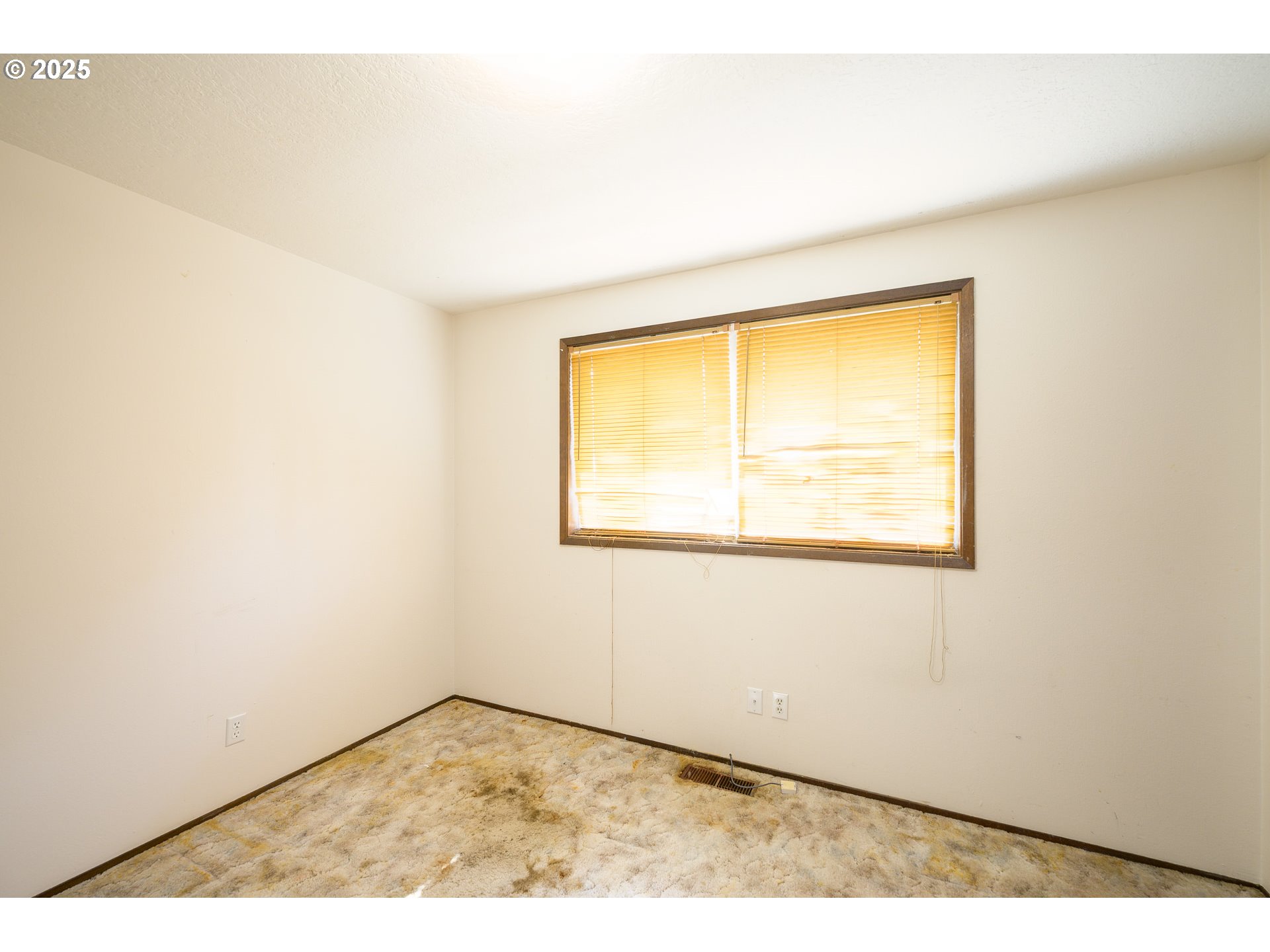 210 South Church Street Newberg, OR 97132 - Photo 11 of 34 a view of an empty room with a window