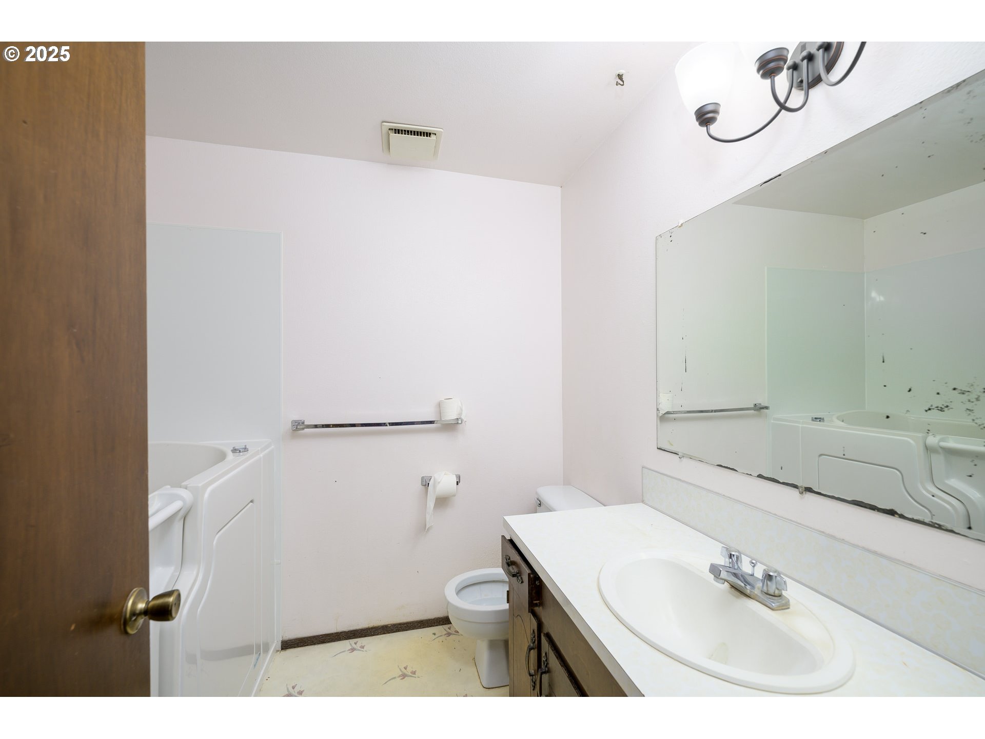 210 South Church Street Newberg, OR 97132 - Photo 15 of 34 a bathroom with a sink and a mirror