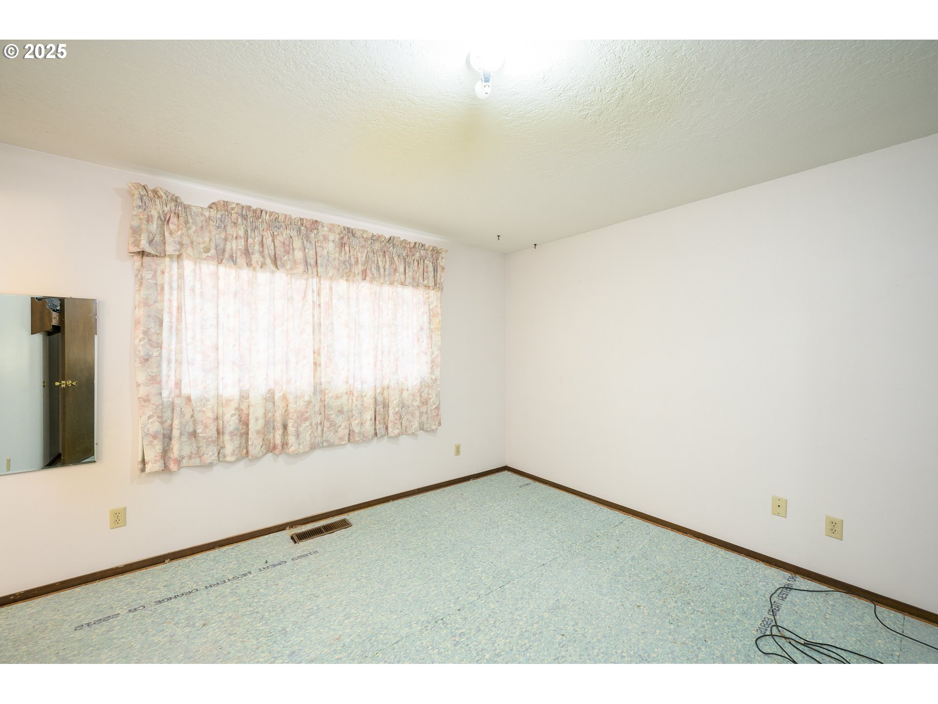 210 South Church Street Newberg, OR 97132 - Photo 7 of 34 a view of an empty room with a window