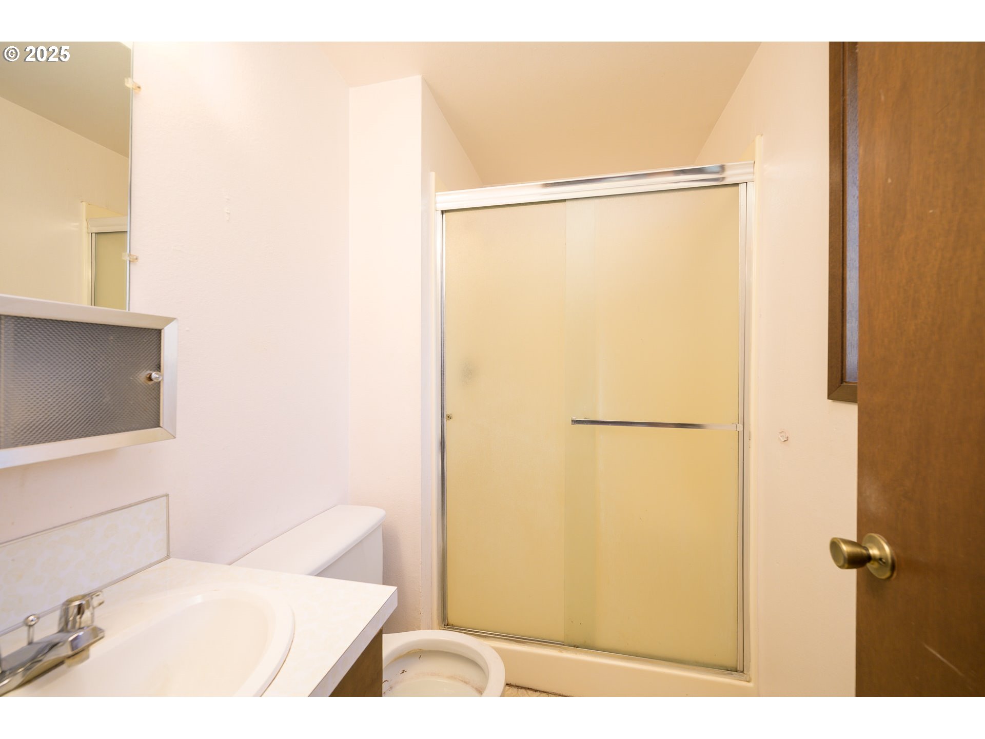 210 South Church Street Newberg, OR 97132 - Photo 9 of 34 a bathroom with a shower and a toilet