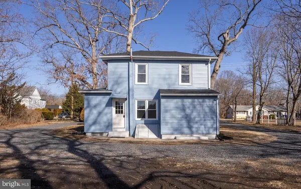 a view of a house with a tree