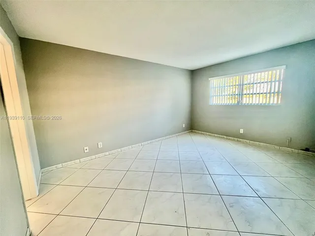 a view of an empty room and window