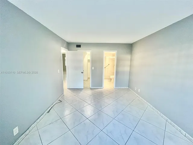 a view of an empty room and window shelves