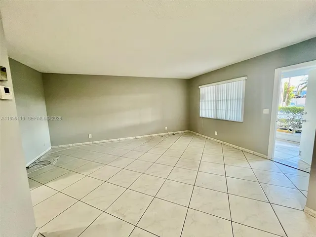 a view of an empty room and window