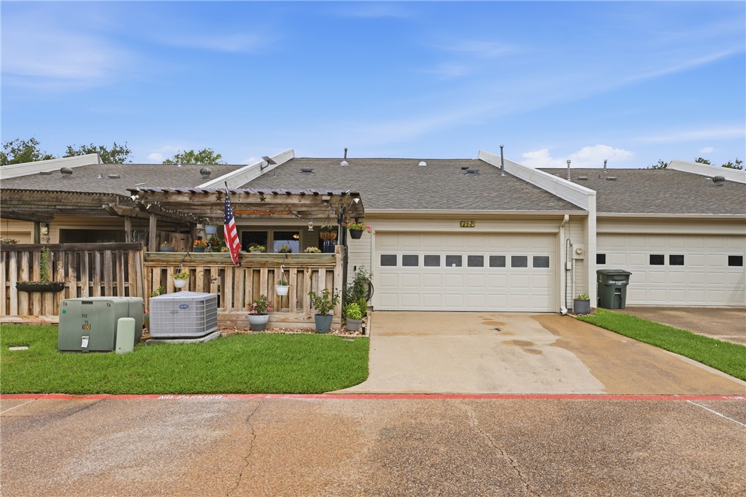 1520 Bennett Street Bryan, TX 77802 - Photo 22 of 24 a front view of a house with a yard and garage