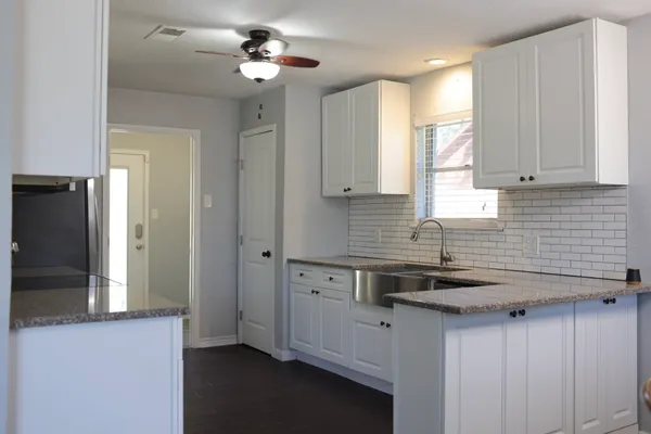 a living room with a fireplace and a window