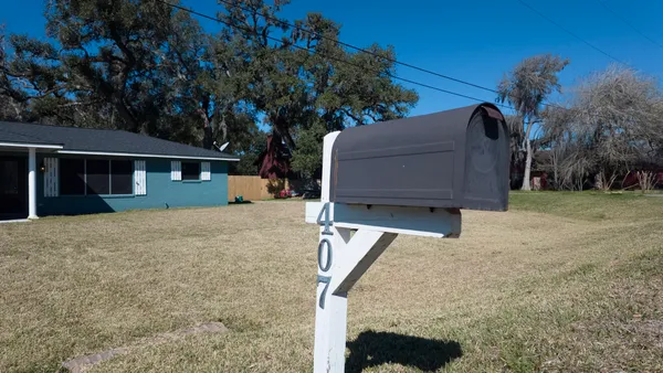 a living room with wooden floors and a fireplace
