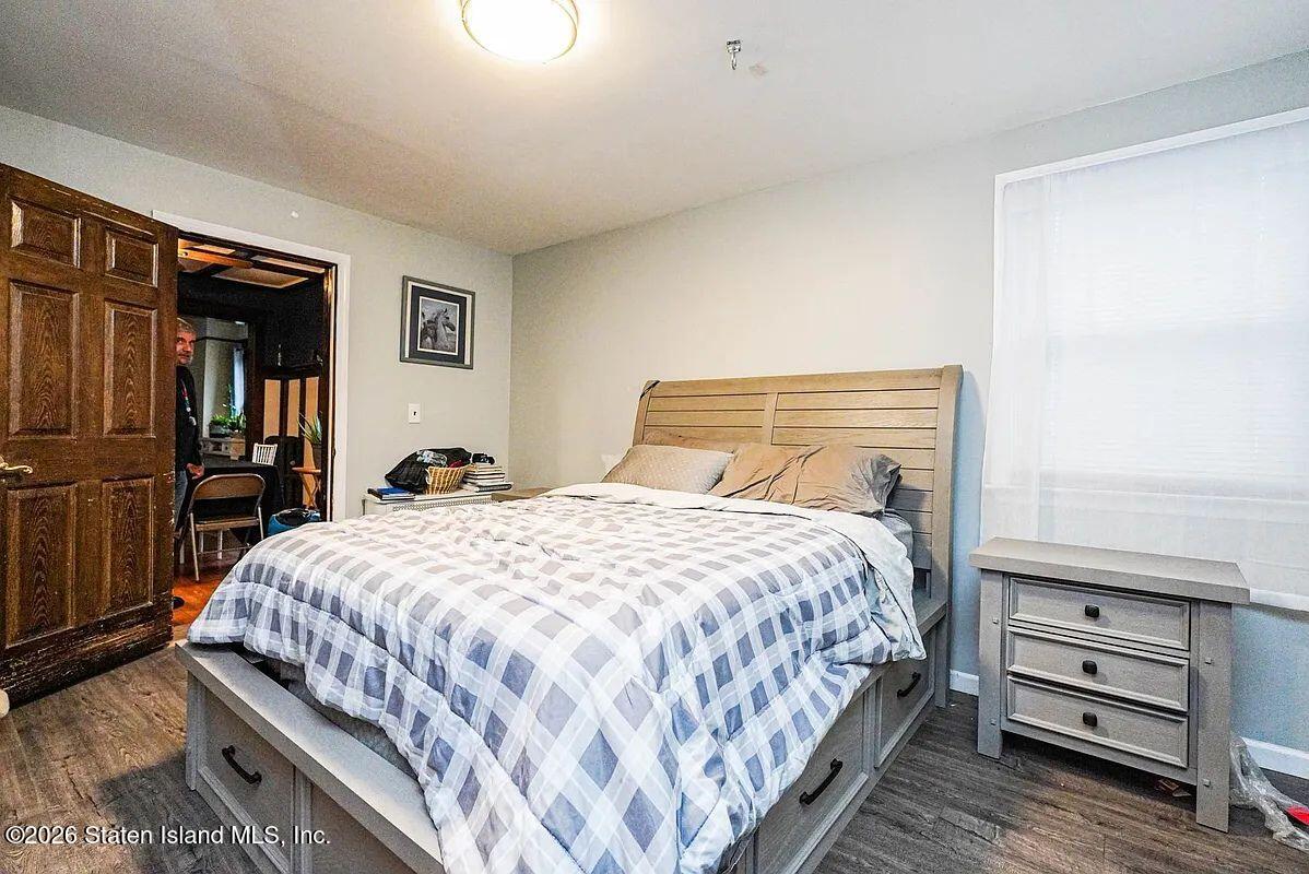 202 Watchogue Road Staten Island, NY 10314 - Photo 15 of 19 a bedroom with a bed and dresser